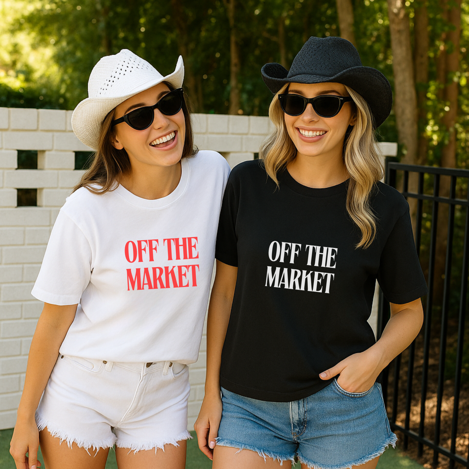 Two women wearing 'OFF THE MARKET' t-shirts outdoors.