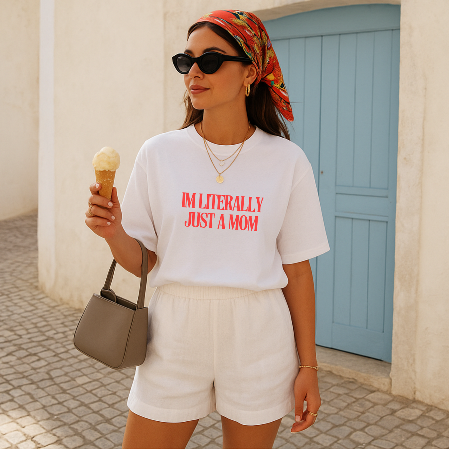 Woman wearing tshirt with 'i'm literally just a mom' on the front