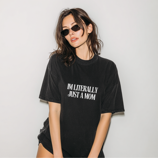 Woman wearing a black t-shirt with text on a plain background